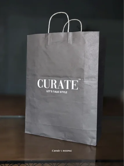 Curate black color printed paper bag