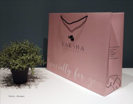 Customer holding the stylish, eco-friendly Personalized Paper Bag from Yaksha Design House
