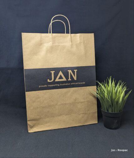 Ethically-minded shopper in Australia carrying our Natural Kraft Paper Bag