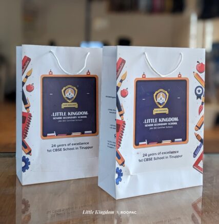 Paper bag with Little Kingdom School emblem, symbolizing Tiruppur's Pride