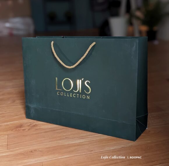 Close-up view of the Customized Luxury Paper Bag from Loji's Collection, featuring intricate gold foil stamped designs