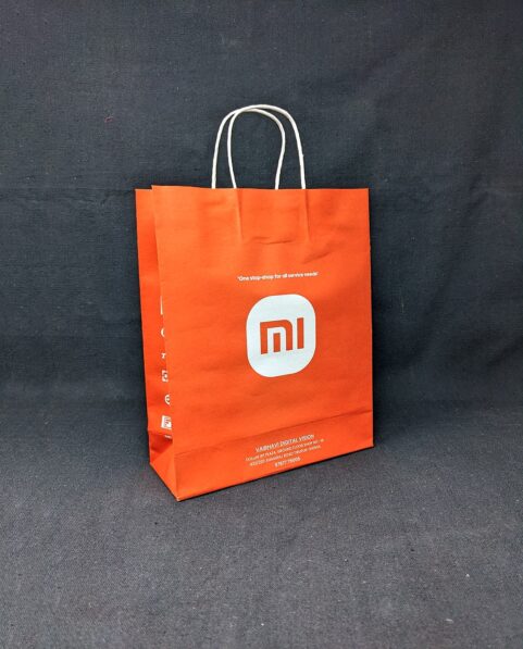 Close-up view of the Xiaomi MI Mobile Store paper bag, showcasing the recognizable MI logo