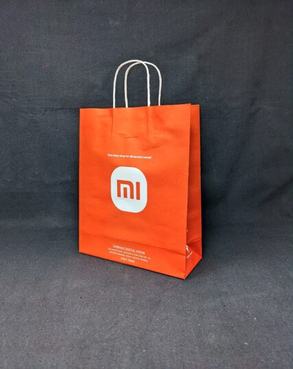 Spacious and durable Xiaomi MI Mobile Store paper bag, perfect for carrying your gadgets