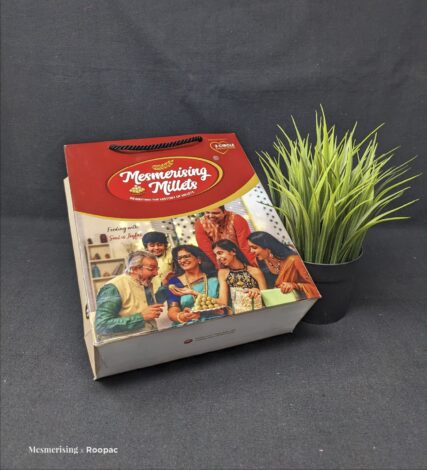 Colorful Paper Bag from Mesmerising Millets, filled with nutritious and tasty food items
