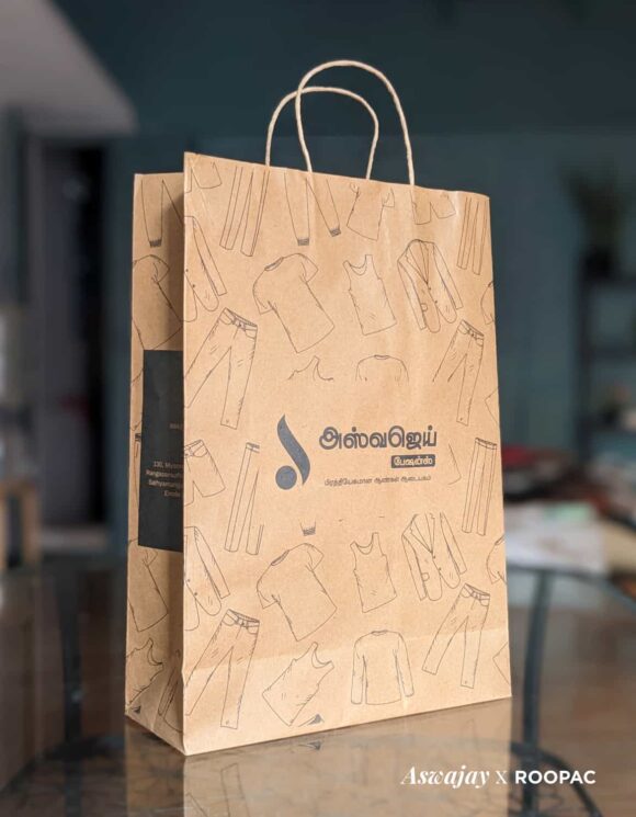 Aswajay Fashions' brown Kraft paper bag filled with exclusive menswear collections