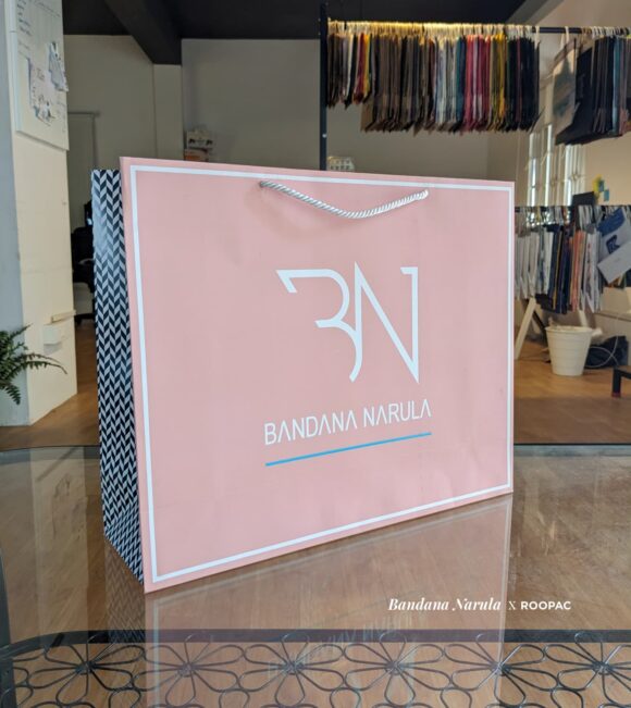 Bandana Narula Signature Paper Bag filled with Indo-western contemporary clothing