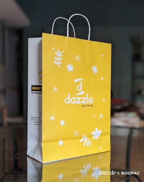 Dazzle's Paper Bag showcasing trendy design against Coimbatore city backdrop