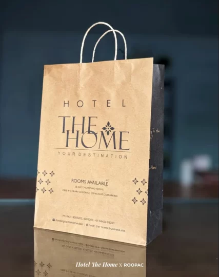 Hotel The Home' High-Quality Hotel Laundry Bag displayed in a tastefully decorated hotel room in Tiruppur