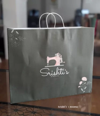 Creative Designer Paper Bag from Srishti's Boutique, filled with unique fashion pieces