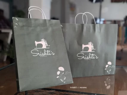 Stack of Creative Designer Paper Bags from Srishti's Boutique, highlighting their artistic design and strength