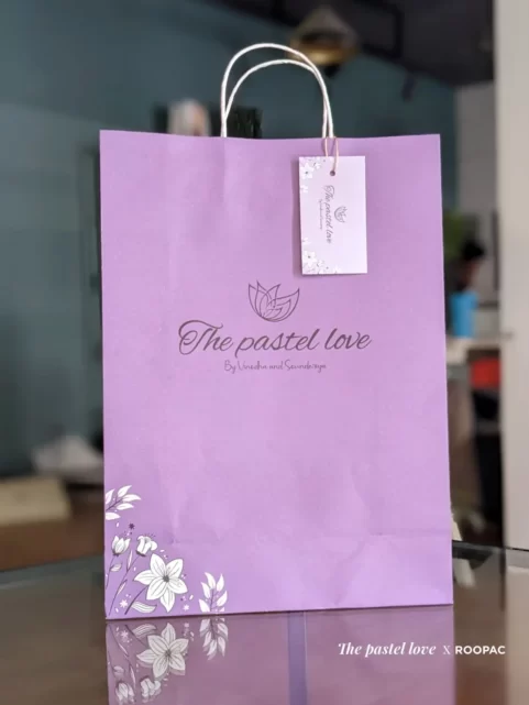 The Pastel Love Paper Bag standing upright in a light setting.