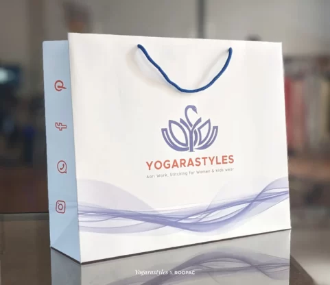 Image of a Yogarastyles Custom Paper Bag, the perfect sustainable companion for the Yogarastyles clothing store purchases in Basel-Landschaft, Switzerland, available to buy online from India.