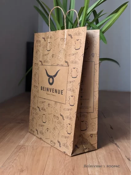 Roopac Durable Brown Kraft Bags filled with men's clothes at "Bienvenue" Men's Clothing Store in Tiruppur.