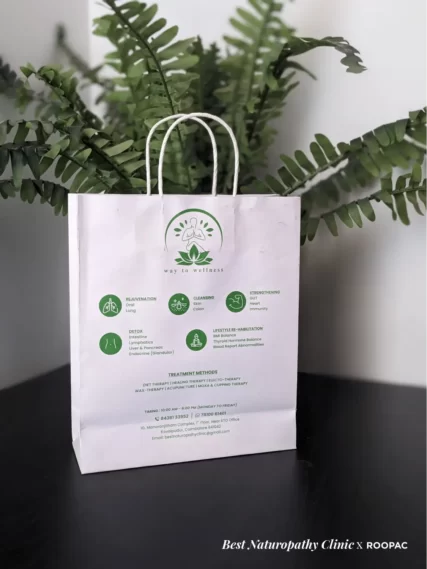 Stacks of Roopac's sustainable printed paper bags ready for use at the Best Naturopathy Clinic in Coimbatore.