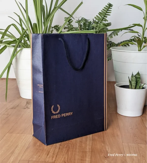 Fred Perry paper bag with blue Denim texture design, made from durable brown kraft, with Fred Perry logo, Original Since 1952, UK. bag made from Roopac, India