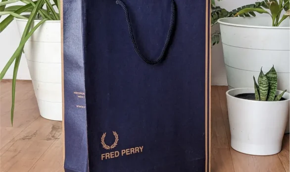 Fred Perry paper bag with blue Denim texture design, made from durable brown kraft, with Fred Perry logo, Original Since 1952, UK. bag made from Roopac, India