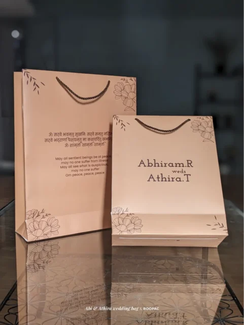Custom-designed paper bag for Abiram & Athira's wedding.