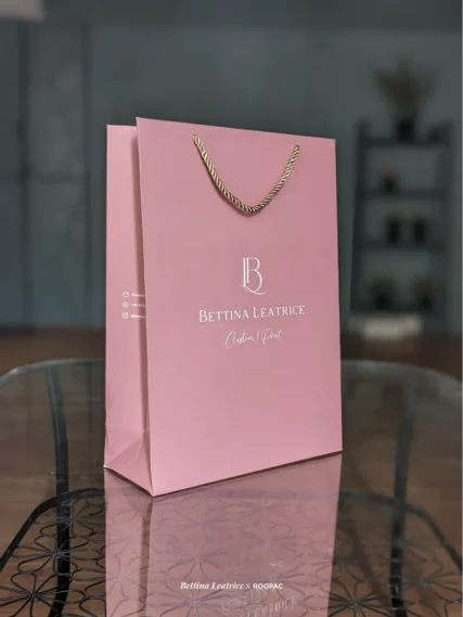 Coimbatore's Bettina Leatrice bag in soft pink with contrasting white branding.