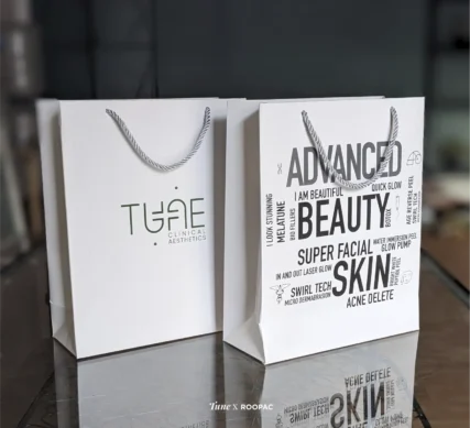 Paper bag showcasing Tune Aesthetics' commitment to top-tier facials