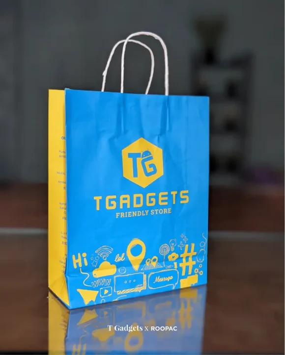 Vibrant blue T Gadgets bag adorned with yellow gadget doodles