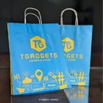 Tech-inspired T Gadgets bag with playful yellow prints on blue.