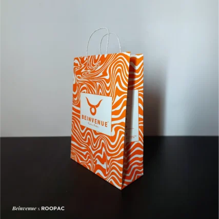 Display of colorful paper bags for menswear - Tirupur