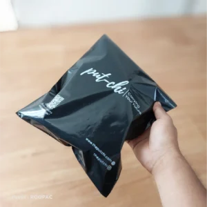 Elegant black poly mailers designed by Roopac, featuring The Putchi’s branding