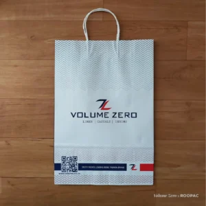 Durable red and blue paper bag for Volume Zero's clothing stores in Tamilnadu